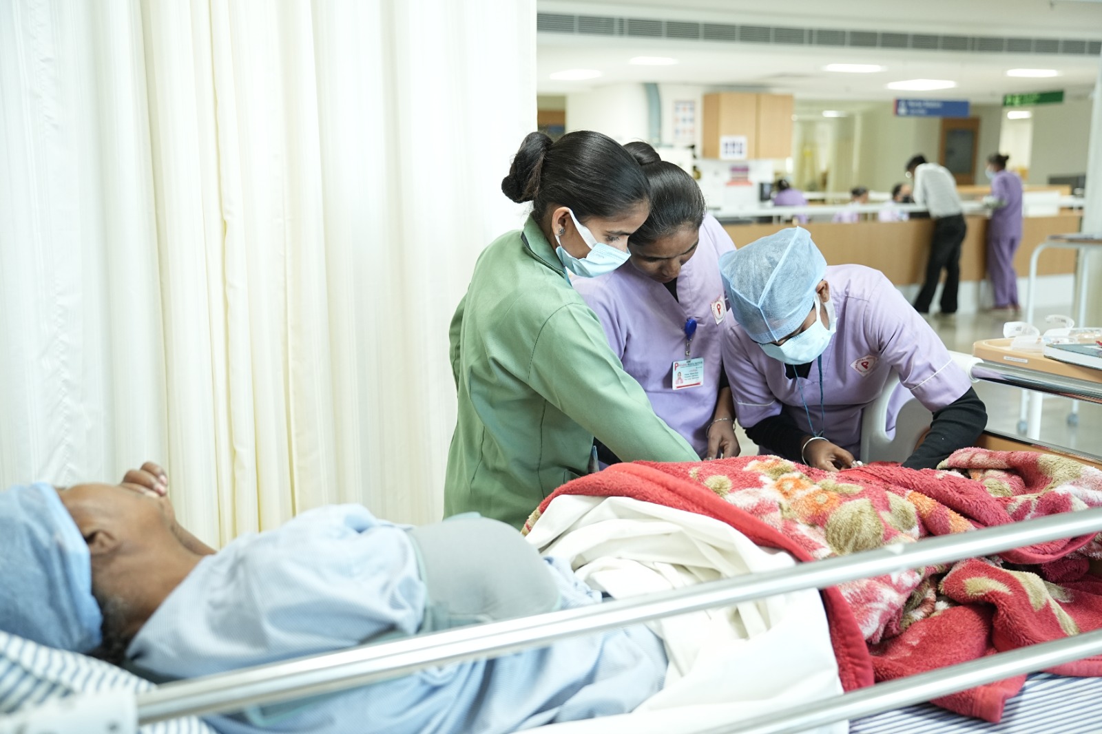 “International Nurses Day 2026 celebration, nurses caring for patient in hospital ward, importance of nursing staff in healthcare”