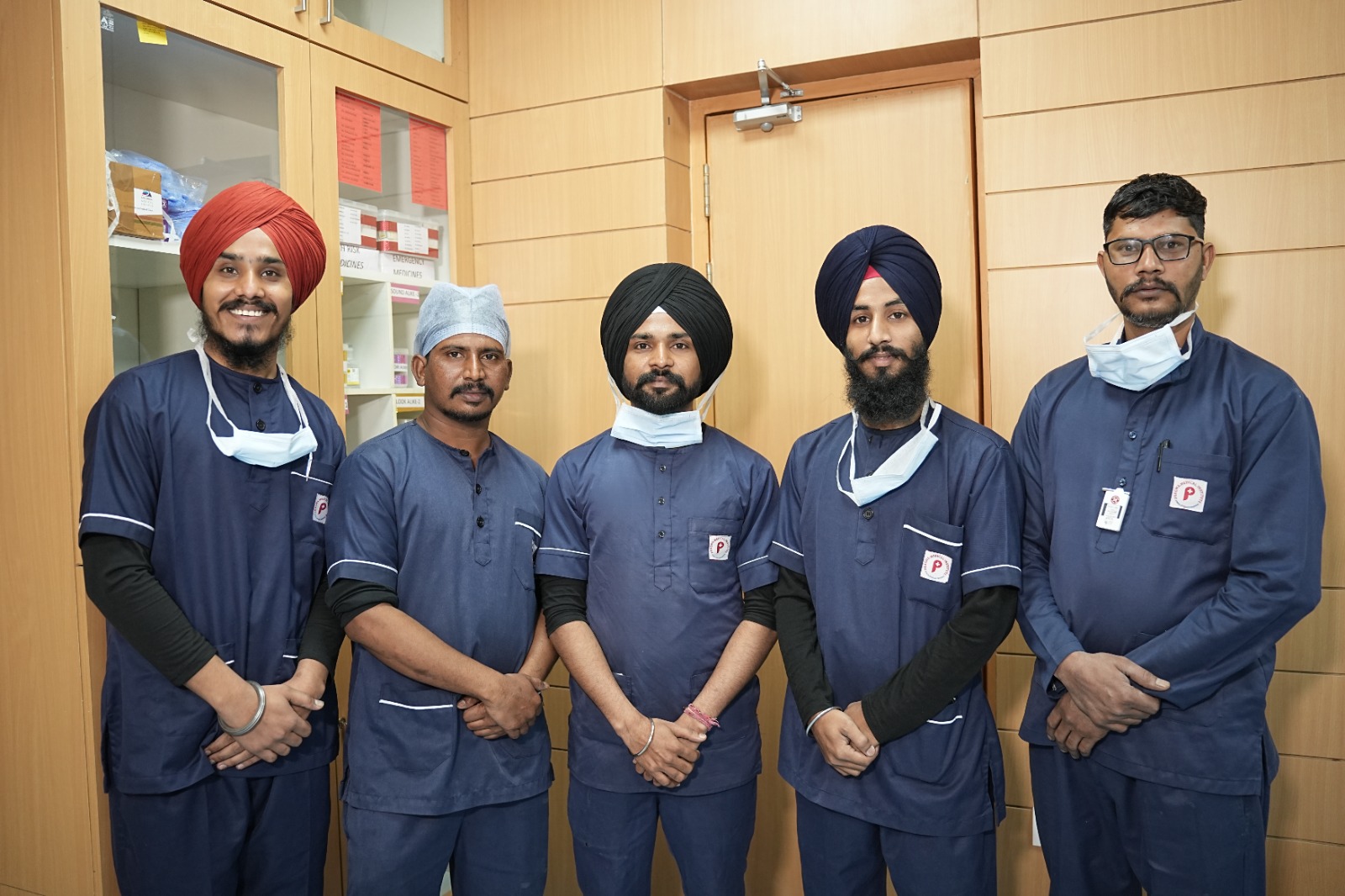 “International Nurses Day 2026, skilled nursing team standing in hospital, dedicated healthcare professionals group”' station